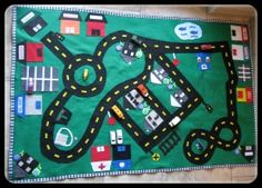 a child's play mat with cars and roads on it