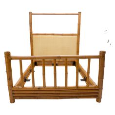 a bamboo bed frame with an upholstered headboard