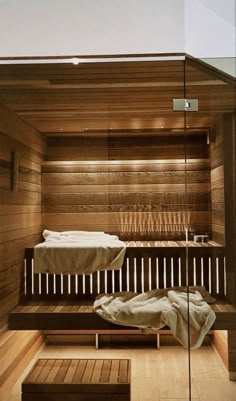 a wooden sauna with two beds in it