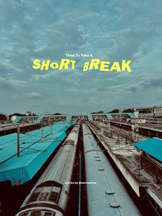 there are many trains on the tracks and one is blue with yellow text that says time to take a short break