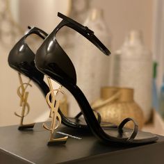 Reposhing This Item I Purchased From @Oidixon. Loved It, But Ready To Rotate For Something New. Questions? Leave A Comment Below! Black Ysl Shoes, Gold Ysl Heels, Black Heels Gold Accent, Sleek Black Heels, Unique Heels Classy, Black Dress Gold Shoes, Ysl Heels Aesthetic, Prom Shoes Blue, Fancy Shoes For Women