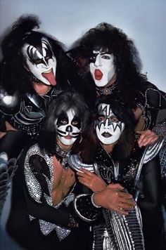 the kiss band is posing for a photo in their black and white makeup costumes,