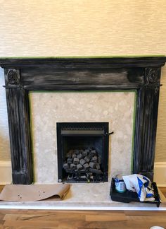 the fireplace is being painted and ready to be installed