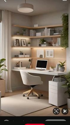 a computer desk with a laptop sitting on top of it in front of a window