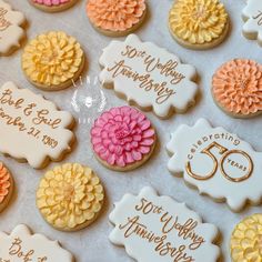 decorated cookies are displayed on a table for someone's 50th wedding anniversary party or special occasion