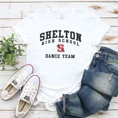 Shelton High School Dance Team Shirt If you’re the school spirit type, this Shelton High School Dance Team Shirt is for you! Get ready to show your SHS pride with this comfortable and stylish shirt, perfect for cheering on your favorite dance squad. Go Climbers!! Choose T-shirt, Crewneck Sweatshirt or Hoodie Sweatshirt. Super comfy unisex sizes. Our shirts, hoodies, and sweatshirts are crafted with comfort and quality in mind. Made from premium materials, they are soft, durable, and perfect for High School Dance Team Mom Shirts, High School Dance Team Shirts, Dance Team Tshirt Designs, Dance Team Clothes, High School Dance Team, School Dance Team, Team Mom Shirt, Dance Squad, Dance Team Shirts