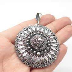 Great antique condition.  925 Sterling Silver Antique Cannetille & Filigree Large Round Pendant  Weight: 17.5g   WELCOME TO PAWN SHOP We are an actual pawn shop and have been in business for over 25 years. Since 1990, our establishment has been serving a variety of clients by providing them with short term cash solutions and options of liquidity regarding their treasured heirlooms. Acknowledging that today′s customers are very sophisticated and are looking for a variety of investments, our acqui Filigree Pendant, Pawn Shop, Round Pendant, Silver Flowers, 25 Years, Link Bracelets, Locket, Diamond Jewelry, Jewelry Necklace Pendant