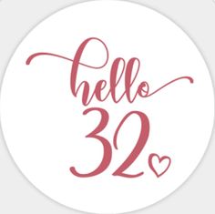 a round sticker with the words hello, 32 and hearts in red on it