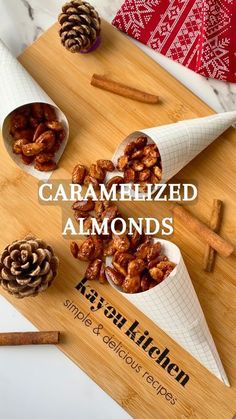 caramelized almonds in cones on a cutting board with cinnamon sticks and spices