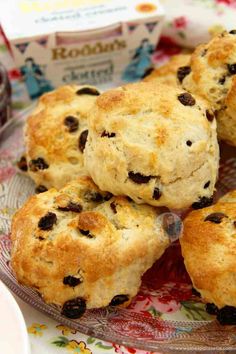 several biscuits on a glass plate with jam in the background