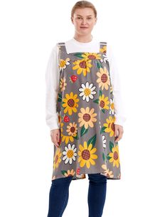 a woman wearing an apron with sunflowers on it