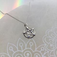 14mm x 17mm sterling silver pentacle charm, on your choice of 16" or 18" .925 sterling silver cable chain, with spring clasp closure. ★ POLICIES: Please see the drop down FAQs menu All items are FINAL SALE. https://www.etsy.com/shop/lotusfairy/policy ★ IMPORTANT  This product is not intended to be used by, or around, anyone under the age of 13.  ShopEarthshine.com★ lotusfairy.etsy.com  Canadian buyers: Prices shown include GST/HST. Nickel Free Symbolic Sterling Silver Charm Necklace, Symbolic Sterling Silver Dangle Charm Necklaces, Symbolic Sterling Silver Charm Necklace With Adjustable Chain, Nickel Free Mystical Sterling Silver Necklace, Nickel-free Mystical Sterling Silver Necklace, Nickel-free Sterling Silver Mystical Necklace, Hypoallergenic Sterling Silver Dangle Charm Necklaces, Hypoallergenic Sterling Silver Dangle Charm Necklace, Hypoallergenic Sterling Silver Charm Necklace With Dangle