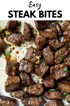 steak bites on a white plate with parsley