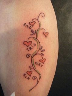 a tattoo with hearts and vines on it