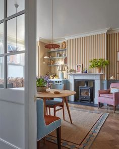 a living room filled with furniture and a fire place