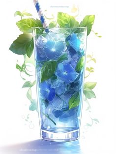 a glass filled with water and blue flowers