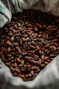 a bag full of coffee beans sitting on top of a table