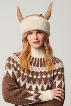 Don the charismatic Viking hat and become the life of winter's party, whether you're in the valley or speeding down the slopes. Featuring a pair of sheepskin horns—lending levity to arctic weather—the vintage-inspired Viking boasts a dual-color suede exterior. And you just can't beat its plush shearling interior-side for effortless warmth and all-day comfort. The velvety-soft Viking is finished with a wide but adjustable turned-up shearling brim, charming raw-edge seams, and a dash of good fun. Viking Hat, Novelty Hats, Promo Gifts, Sheepskin Slippers, Sheepskin Coat, Winter Party, Sheepskin Rug, Winter Time, Hat Making