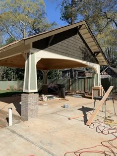 an outdoor covered patio being built in the back yard