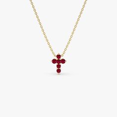 Presenting our 14K Gold Ruby Mini Cross Necklace, featuring 0.24 ctw of rubies in a refined and graceful design. This dainty necklace, adorned with the July birthstone, is perfect for everyday elegance and meaningful occasions. Perfect as a graduation gift, it merges religious symbolism with a modern, minimalist style. Carefully crafted, this piece offers timeless beauty with a personal and meaningful touch. ▶Item Details * Gold Kt: 14K * Custom Gold Color: Rose Gold, Yellow Gold, White Gold * Length & Width: 9.75x7.25MM * Round Ruby: 6 Pcs 1.9 MM * Total CTW: 0.2 * Setting Type: Prong Setting * Ready to Ship in 1-2 Business Days ▶ See more of our Sapphire Jewelry - https://etsy.me/3JDo6hp ▶ See our storefront here - http://etsy.me/2lUcVnH  ▶ All store sections here * Diamond Rings - http: Everyday Elegance, Gold Armband, Mini Cross, Necklace Minimalist, Ruby Jewelry, July Birthstone, Emerald Jewelry, Sapphire Jewelry, Gold Wedding Band