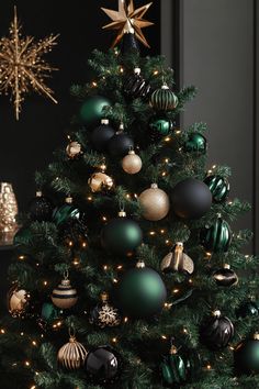 a green christmas tree with gold and black ornaments