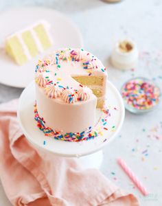 a white cake with sprinkles on it