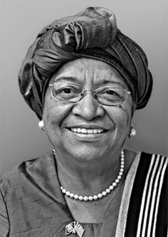 an older woman wearing a turban smiles at the camera while posing for a black and white photo