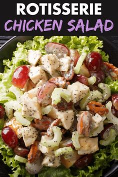 chicken salad with lettuce and cherry tomatoes in a black bowl