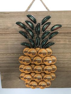 a pineapple made out of oranges hanging on a wall