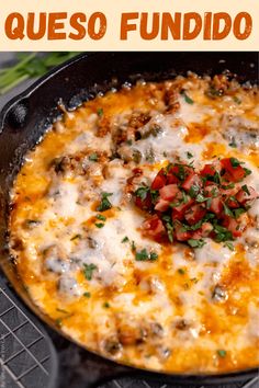 a skillet filled with cheese and vegetables