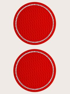 two round red plates with diamond trims on each one and the other side is shown