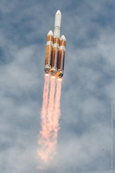 an image of a rocket that is in the air