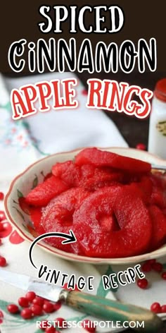 Dish with cooked red apple rings with Pinterest overlay. Cinnamon Rings Recipe, Spiced Apple Rings Recipes, Cinnamon Apple Rings Recipe, Cinnamon Spiced Apples, Spiced Apple Rings Canned, Canning Spiced Apple Slices, Canning Cinnamon Apple Slices, Red Cinnamon Apples, Apple Cinnamon Rings