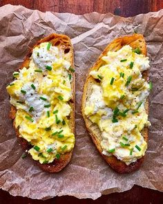 two pieces of bread topped with eggs and chives