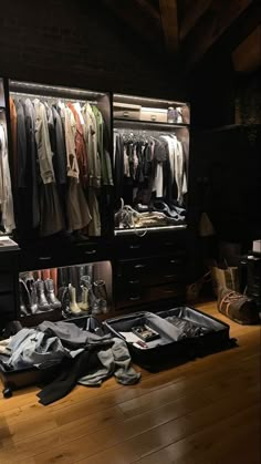 an open closet filled with clothes and shoes