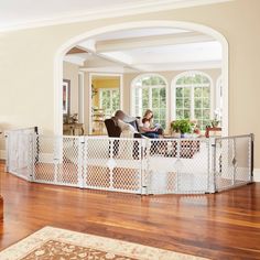 a living room filled with furniture and lots of windows