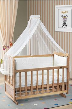 a baby crib with a mosquito net over it