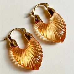 Anthropologie “Gabi” Sculptural Mandarin Orange Striped Scalloped Striated Parabola U-Shaped Frosted Tranparent Illuminated Dreamy Thick Loop Gold Hoops. Trendsetting Carved Scalloped Thick U-Shaped/Parabolic Hoops In A Mandarin Orange Color That Illuminate In The Light. With Gold Caps At The Tops/Peaks And Bar Snap Closure. Lightweight! New. *Also Available In Cornflower Blue, Navy Blue, Mint Green, Coffee Brown, & Silver! Measurements: Eardrop Length: 1.3” Earring Width: 0.8” If You Want It, D Silver Highlights, Gold Caps, Anthropologie Jewelry, Mandarin Orange, Coffee Brown, Brown Silver, Cornflower Blue, Gold Hoops, Orange Gold