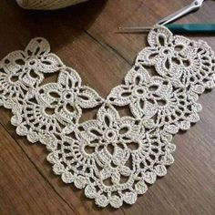 the crochet lace is being worked on