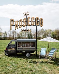 a food truck parked in front of the prostego sign