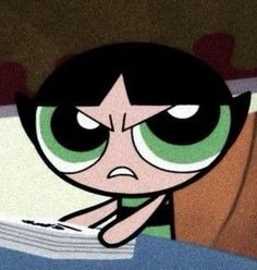 the powerpuff character is sitting in bed with her head on top of a pillow