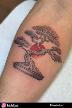 a bonsai tree tattoo on the arm