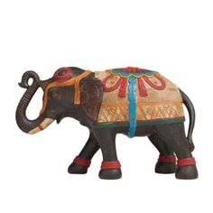 an elephant figurine with decorative decorations on it's back