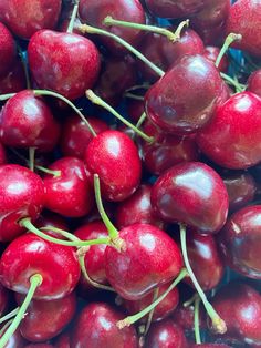 a pile of cherries sitting on top of each other