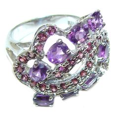 Handmade Unique 925 Sterling Silver ring with unique one of a kind Amethyst,  10.80 grams of marvelous handcrafted jewelry design. Only one piece availble ready to ship! It's unique worldwide ring - simply piece of art in world of fine jewelry. Spectacular genuine  Amethyst Ruby  .925 Sterling Silver HANDCRAFTED  Ring size 8 1/4  RING DETAILS: Weight: 10.80g; Size: 8 1/4; Material: Sterling Silver; Main stone: Amethyst; Other stones: Ruby; Dimension: L- 3/4, W - 1, T- 3/8 inch; Stamp / Mark: 925 Luxury Sterling Silver Amethyst Birthstone Ring, Luxury Amethyst Sterling Silver Ring With Round Stone, Valentine's Day Purple Amethyst Sterling Silver Ring, Spiritual Round Amethyst Ring In Sterling Silver, Luxury Purple Crystal Ring In Sterling Silver, Unique Silver Jewelry, Purple Jewelry, Handcrafted Rings, Online Jewelry Store