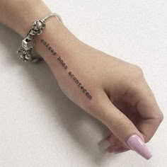 a woman's hand with a small tattoo on it that says, i love you more than someone else