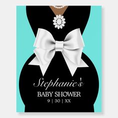 a baby shower sign with a white bow on it's belly and the words stephanie's baby shower