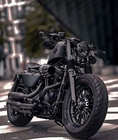 a black motorcycle is parked on the street