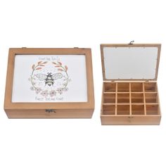 an open wooden box with a bee on the front and bottom, filled with compartments for jewelry