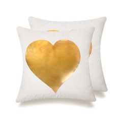 two white pillows with gold foil heart on the front and back, one is made out of